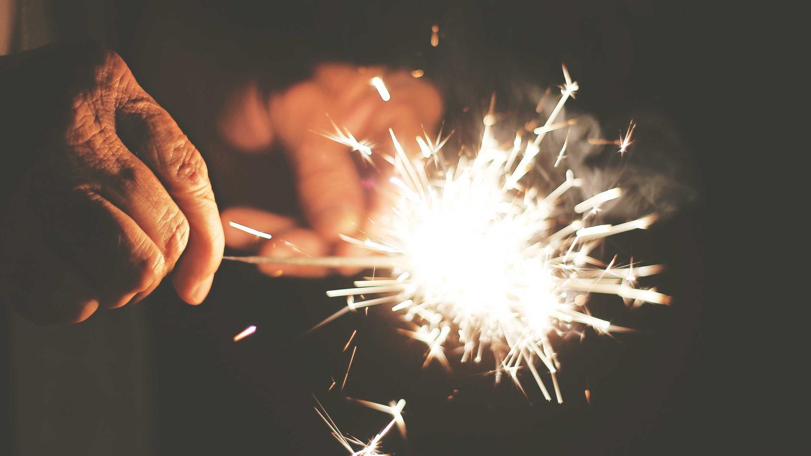 A glass jar with cash labeled emergency fund