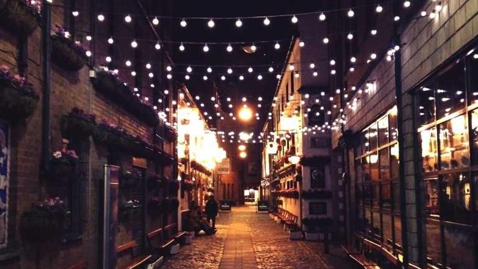 A roller painting a freshly prepped wall in a sunny room