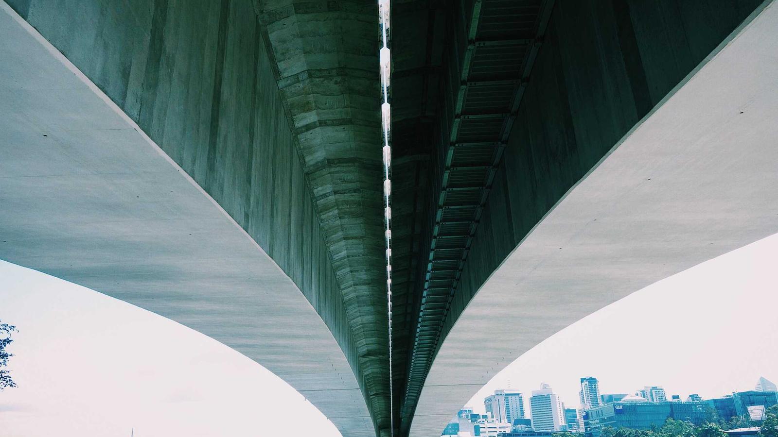 A neatly made bed in a softly lit bedroom